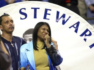 John and Feleica Stewart, the parents of former Kentucky basketball recruit John Stewart, weep as they watch a video tribute to their late son during senior night activities prior to Kentucky's game against Vanderbilt Wednesday, March 5, 2003, in Lexington, Ky. The highly recruited high school star from Lawrence North High School in Indianapolis, Ind., died of heart failure during a state tournament game in March, 1999. This would have been his senior year at Kentucky. (AP Photo/Ed Reinke)(Photo: ED REINKE, AP)