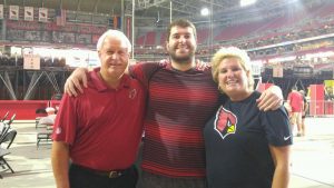 Cole Turner with his new team, the Arizona Cardinals, and his parents Dave and Angie.
