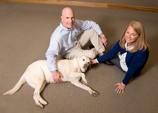 Zville-Storen owners Grey and Kim with their wonderful pet.. by JJ Kaplan