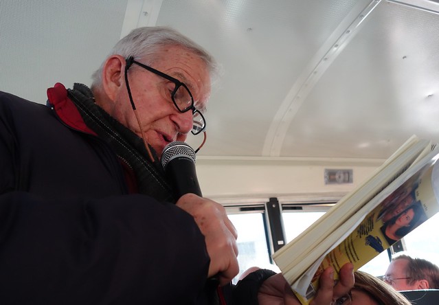 Dan Wakefield reading on bus