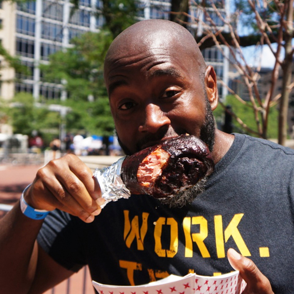 Man eating chicken wing