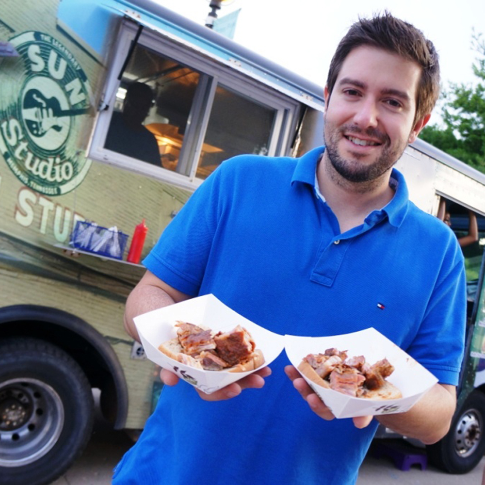 Vendor in front of a food truck