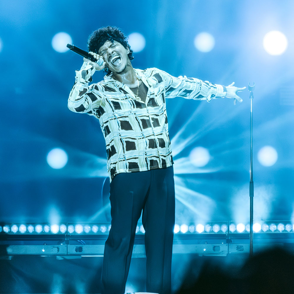 Bruno Mars singing on-stage