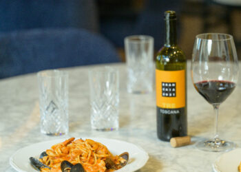 Pasta with wine on a table