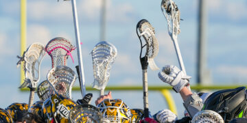 Lacrosse sticks in the air