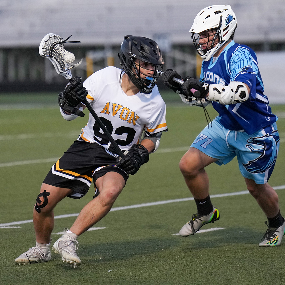 Two male lacrosse players in a match