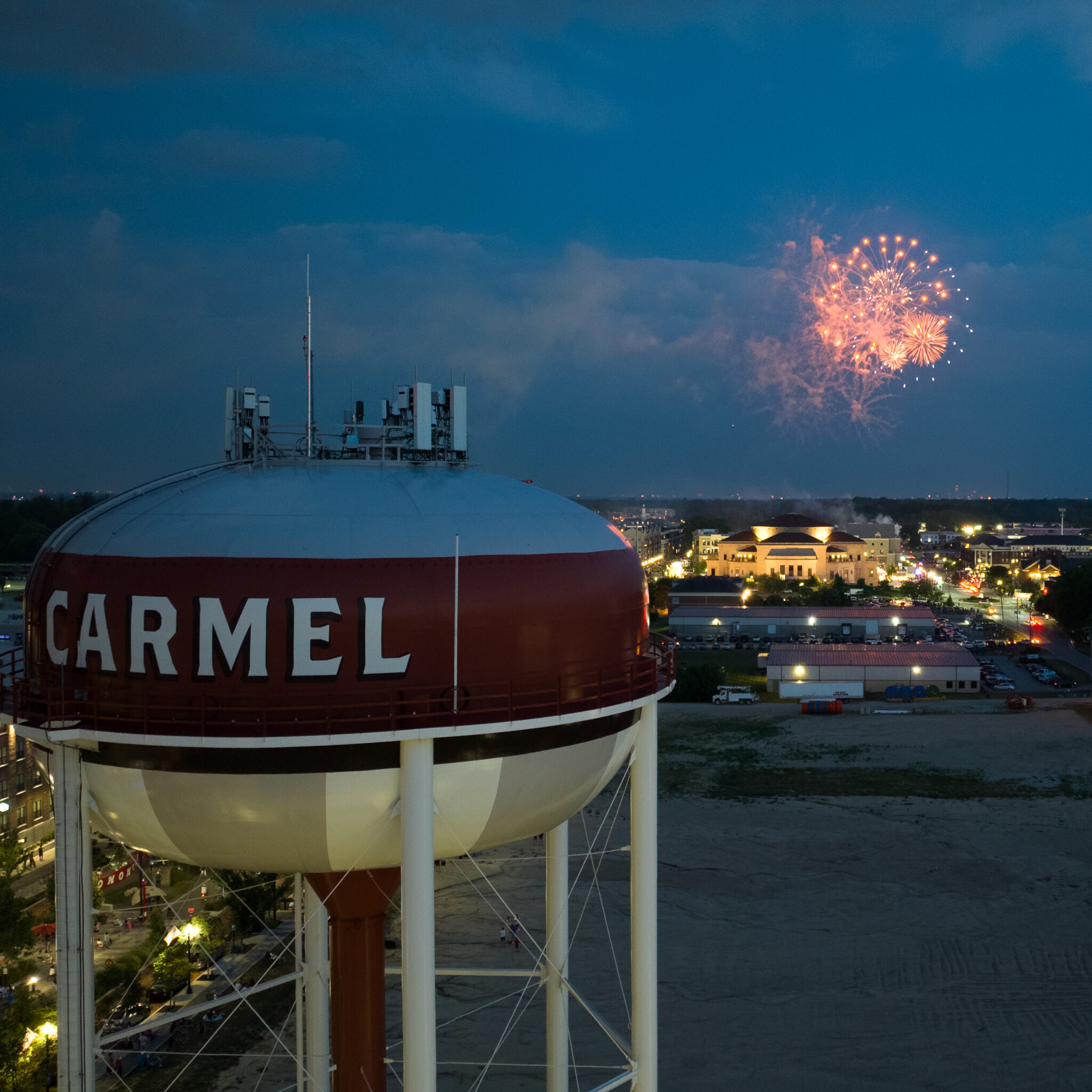 Fireworks over the Carmel, Indiana skyline with the water tower