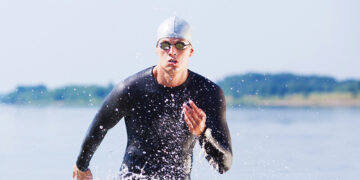 Endurance athlete coming out of the water