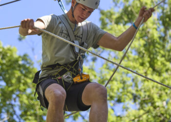 Boy on an outdoor climbing course