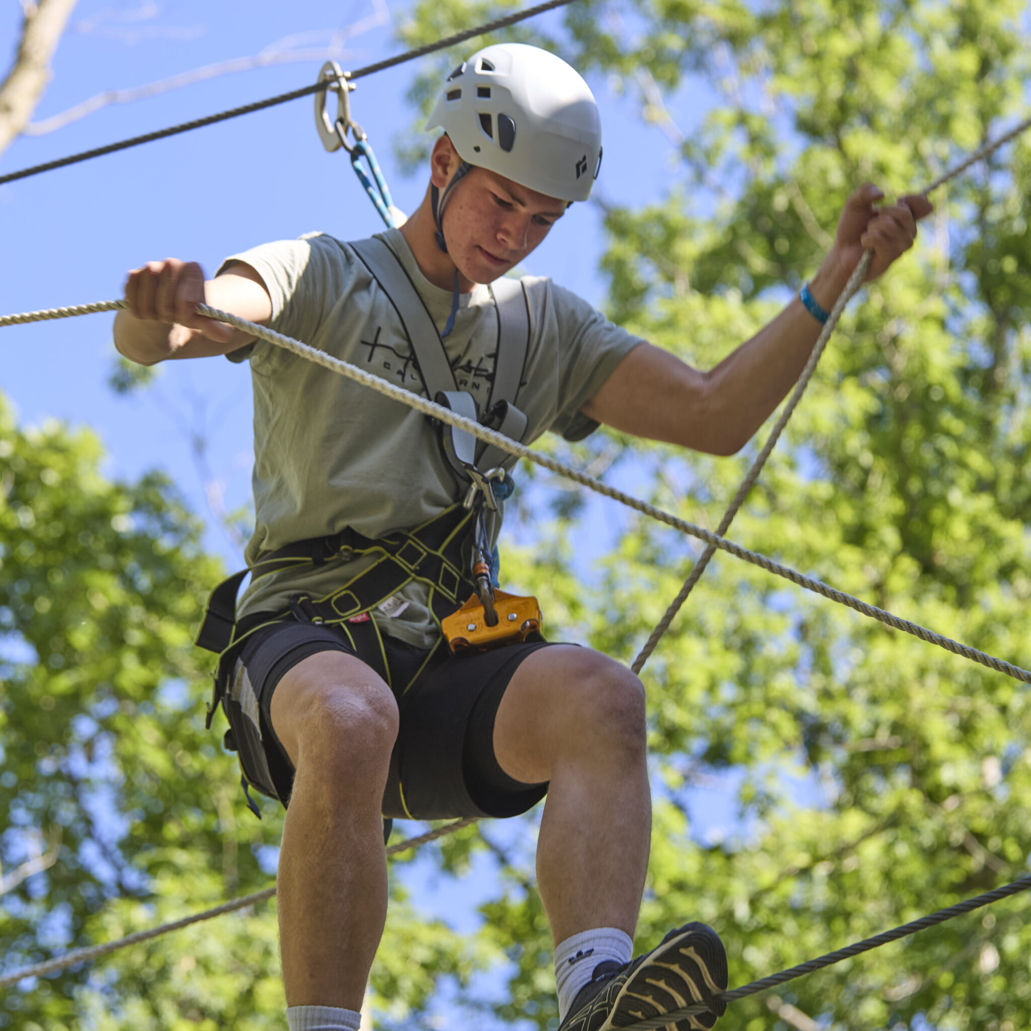 Boy on an outdoor climbing course