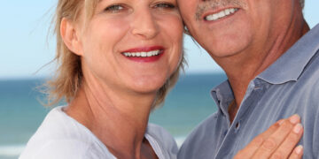 A middle aged couple on a beach
