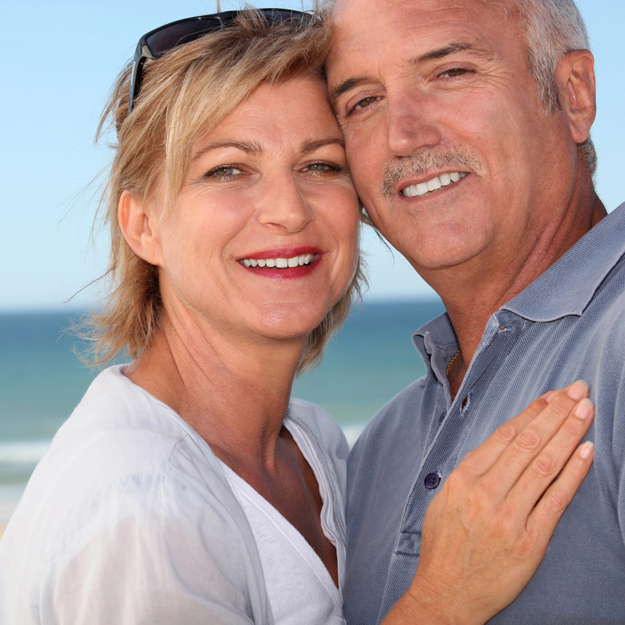 A middle aged couple on a beach