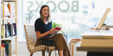 Woman sitting in book store