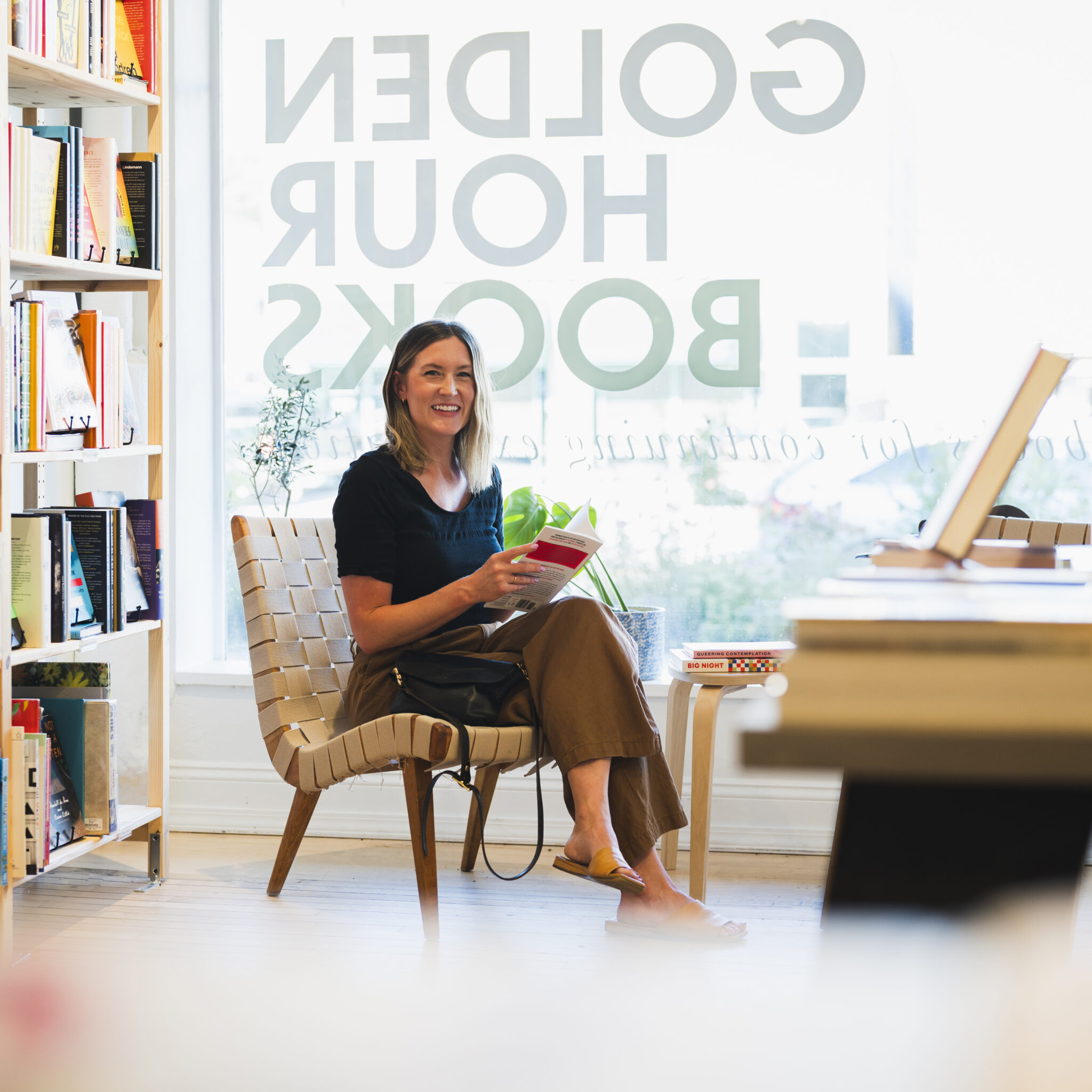 Woman sitting in book store