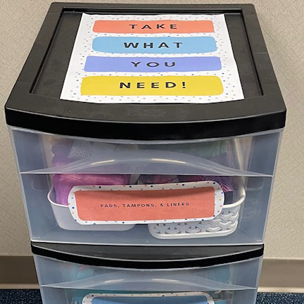 Plastic drawer unit with menstruation items inside