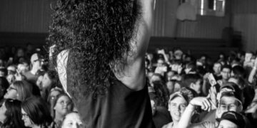 Rock singer onstage in front of a large crowd