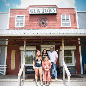 Family outside a firearms store