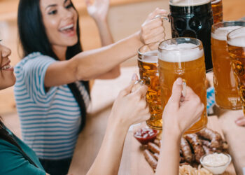 Lady hoisting a beer stein