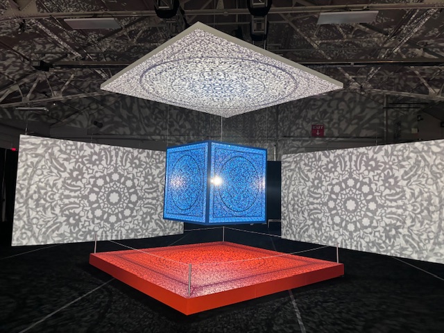 Turquoise cube surrounded by walls with shadowplay