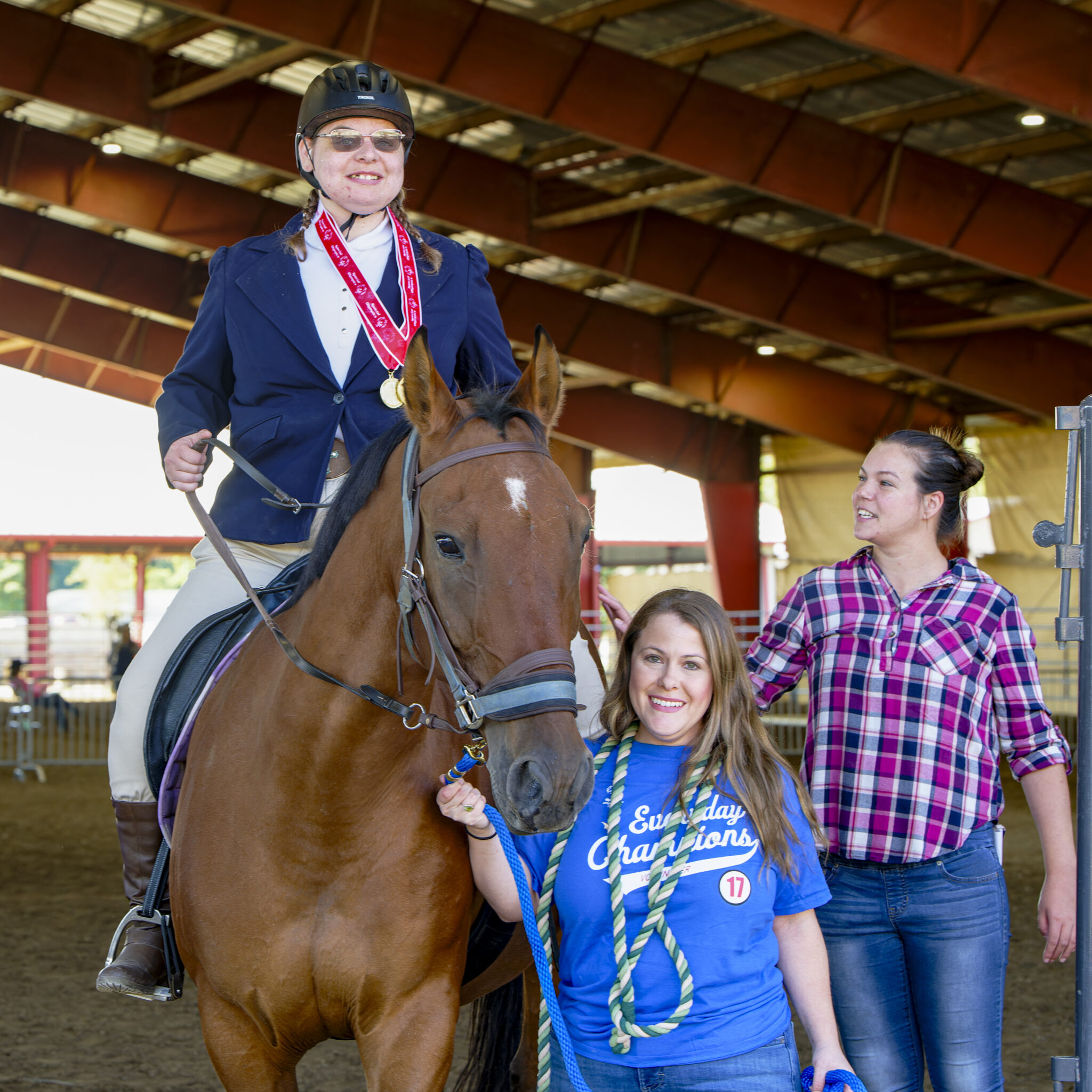 Equestrian athlete being escorted into the ring