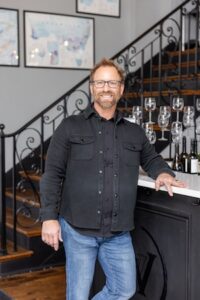 A man standing in a tasting room