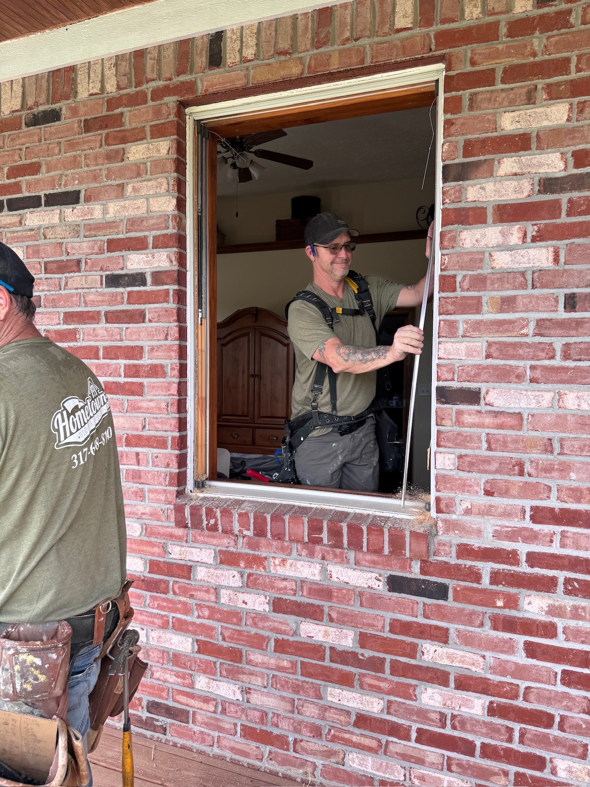 Professional window installation by the Hometown Window and Door Team on a red brick home.