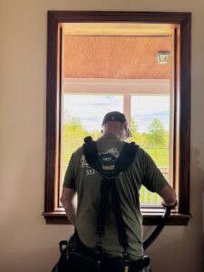 Professional cleanup by a Hometown Window and Door technician after a window installation.