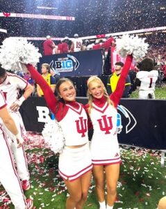 Two cheerleaders on the field