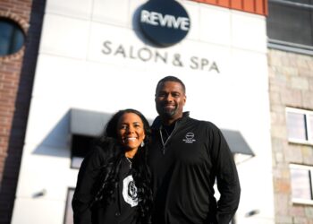Leslie and Jamar Wright in front of Revive Salon & Spa Studio
