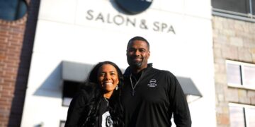 Leslie and Jamar Wright in front of Revive Salon & Spa Studio