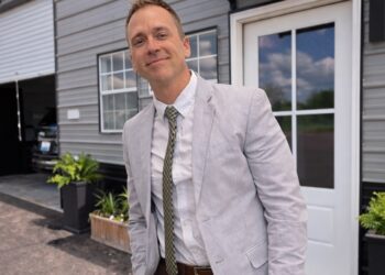 John Thornton standing in front of Simple Body Shop