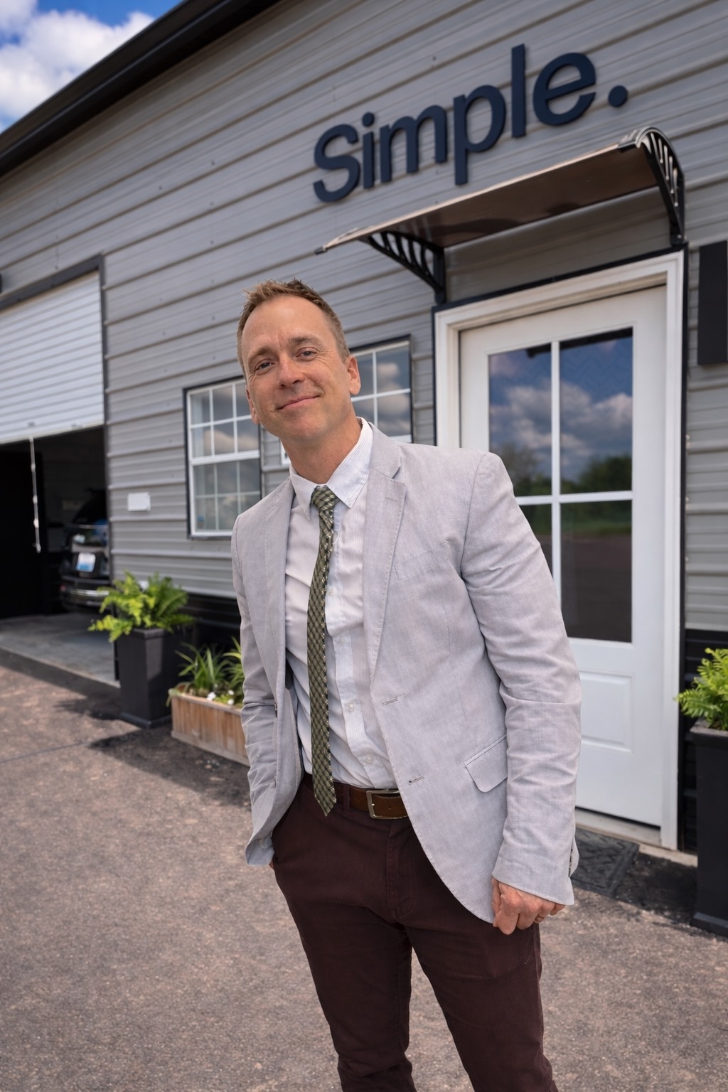 John Thornton standing in front of Simple Body Shop
