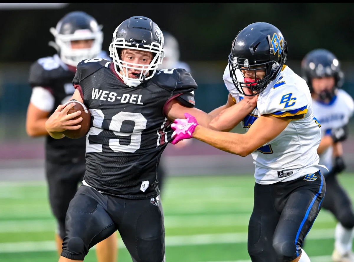 Brock Nauman of Wes-Del High School runs with the football