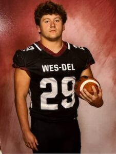 Brock Nauman holding a football