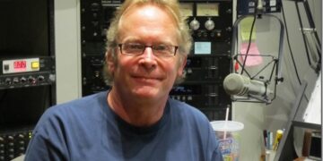 John Timmons in the DJ booth at the radio station