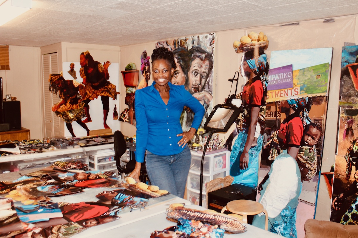 Licia Priest in her art studio with her art work