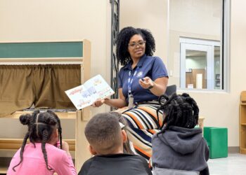 A teacher reading to her students