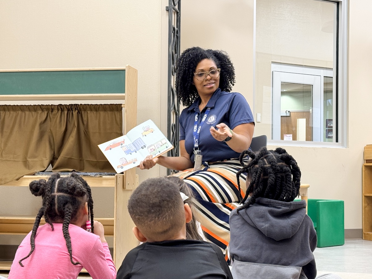 A teacher reading to her students