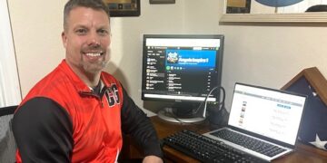 Keith Fechtman sitting at his computer making music with the help of AI