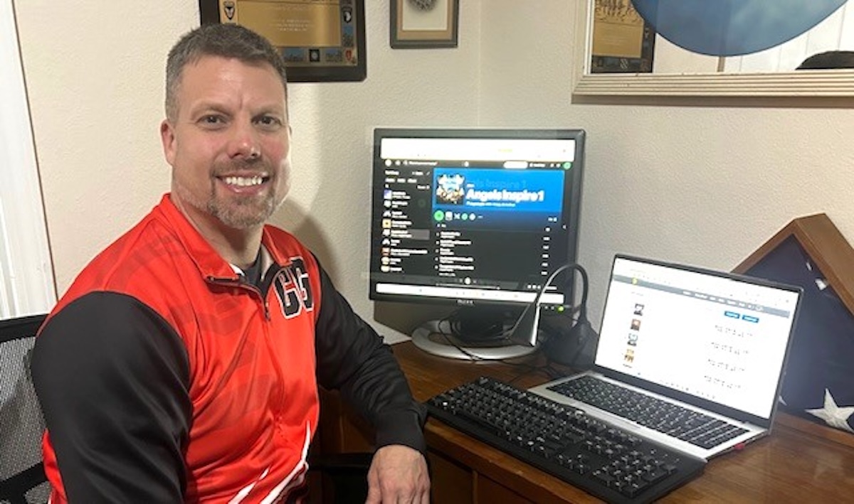 Keith Fechtman sitting at his computer making music with the help of AI
