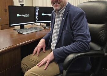 Matt Anderson sitting at his desk at Northwest Bank
