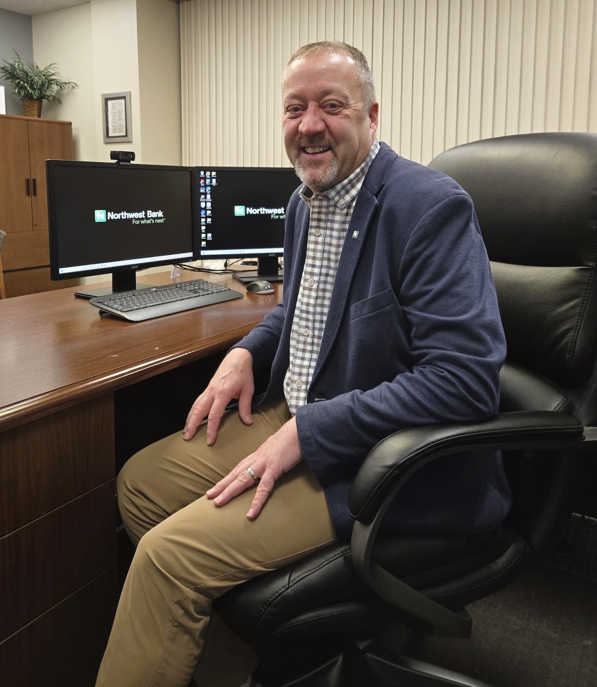 Matt Anderson sitting at his desk at Northwest Bank