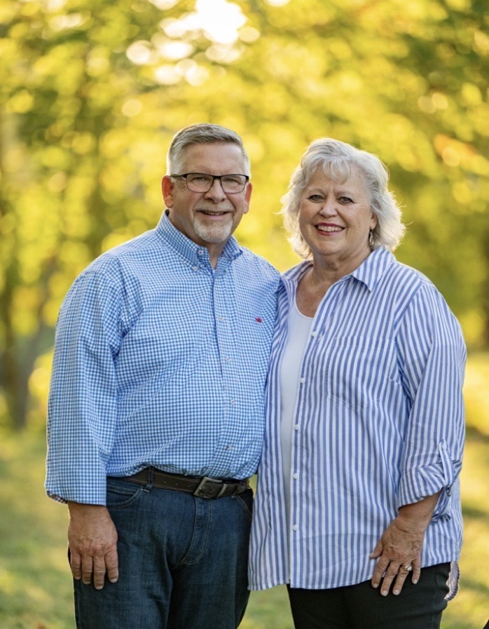 Jack and Sharon McMahon with trees in the background