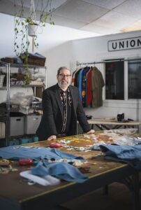 Jerry Atwood standing in his studio