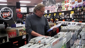 Timmons browses the racks of his now-closed business. The record store will have a final clearance sale on Nov. 29.