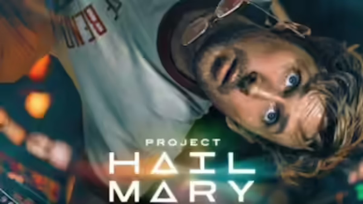 The poster features a close-up, upside-down shot of Gosling as the protagonist, Dr. Ryland Grace, a schoolteacher-turned-astronaut. He appears disoriented, with wide blue eyes and light brown hair, wearing a white t-shirt with dark trim and a pair of aviator sunglasses tucked into the collar. The background shows blurred, glowing lights and high-tech equipment, suggesting he is inside the Hail Mary spacecraft. The film's title, "PROJECT HAIL MARY," is prominently displayed in a stylized white font.