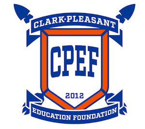 A graphic logo for the Clark-Pleasant Education Foundation (CPEF). The central element is a white shield with a bold orange border, containing the blue acronym "CPEF" and the year "2012" at the bottom. A blue banner curves across the top and bottom of the shield, reading "CLARK-PLEASANT" and "EDUCATION FOUNDATION" in white capital letters. Two stylized blue arrowheads or spearheads point outward from behind the top corners of the shield, and two blue flags or pennants are featured behind the bottom corners.