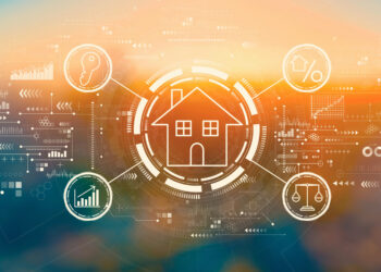 A wide digital graphic illustrates the concept of property technology (PropTech) against a glowing orange and blue background. In the center, a simple white outline of a house is encircled by a glowing ring, representing smart home connectivity. Surrounding the house are circular icons representing key real estate concepts: a key for security, a percent sign for interest rates or financing, scales for legal or compliance, and a bar chart for market growth and analytics. The entire scene is layered with intricate digital data points, arrows, and circuitry patterns, suggesting a futuristic, data-driven real estate market.