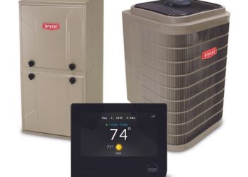 A Bryant brand HVAC system bundle featuring a tan indoor furnace unit on the left, a large tan outdoor air conditioner condenser unit on the right, and a black digital smart thermostat displaying 74 degrees positioned in the foreground.