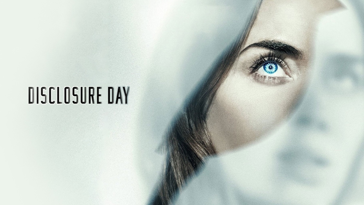 A cinematic movie poster features the title "DISCLOSURE DAY" in a clean, black, sans-serif font on the left against a bright white background. The right side shows a close-up, dramatic composite image of a woman's face partially obscured by layered, translucent white fabric. Her intense, bright blue eye is fully visible and in sharp focus, while her hair sweeps across her cheek and a faded, secondary image of her face appears in the soft-focus background.
